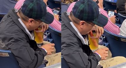 ¿Aberración? Fan de los Yankees causa polémica por beber su cerveza con una salchicha: Video