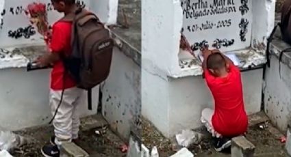 ¡Conmovedor! Niño llora frente a la tumba de su mamá, le enseña su tarea y le lleva flores: VIDEO